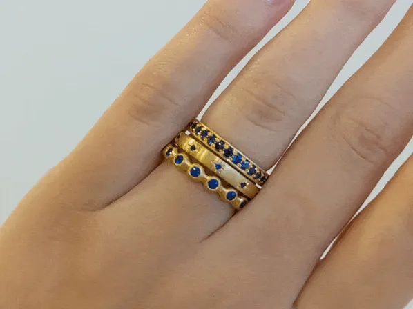 20K Gold Narrow Slightly Rounded Ring with 10 Star-Set Blue Sapphires