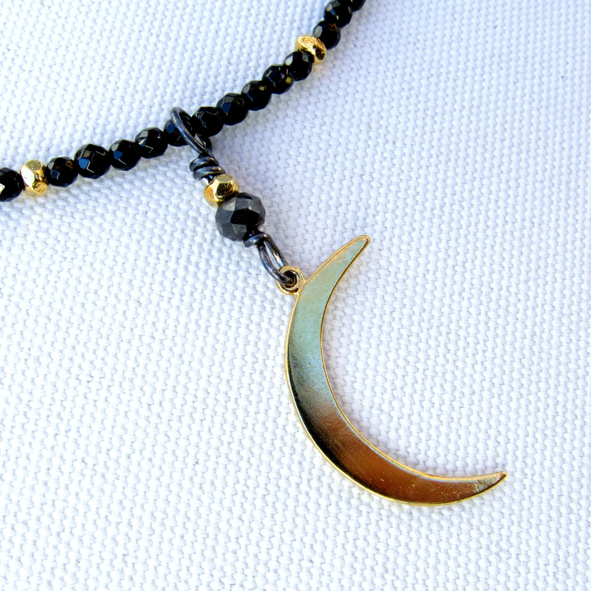 Black onyx, gold vermeil over sterling silver Moon and beads. Black non conflict diamond